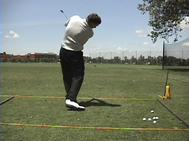 Chuck Mayhew practicing at the driving range